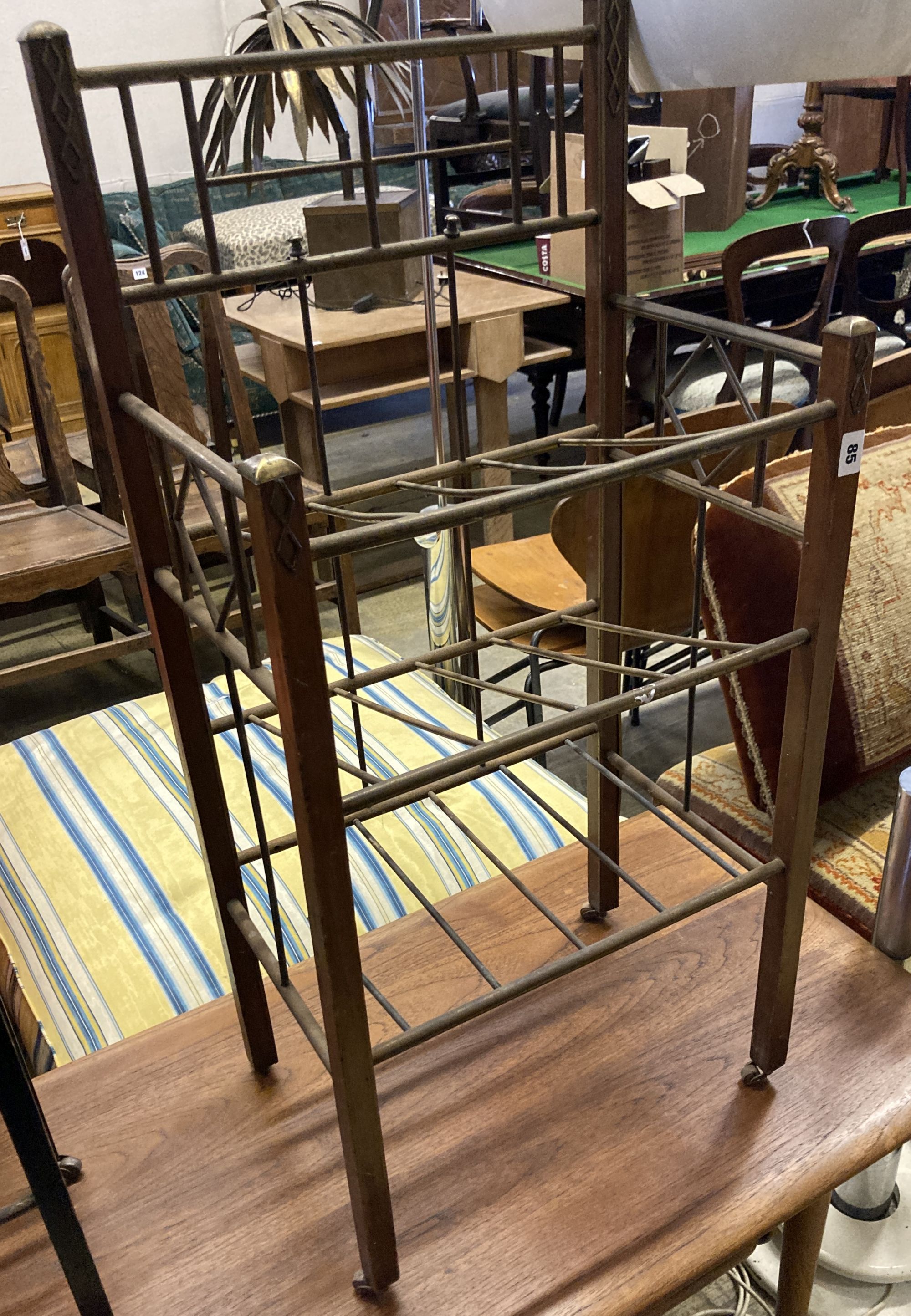 An early 20th century secessionist tubular brass and mahogany three tier newspaper stand, width 45cm, depth 32cm, height 93cm